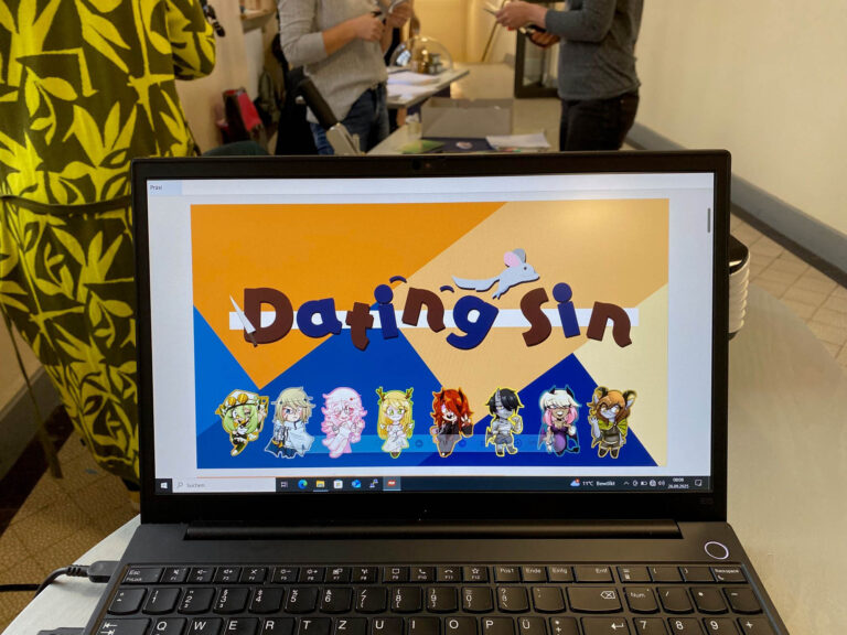 Startbildschirm der Präsentation zum Spiel "Dating Sin" auf einem Laptop